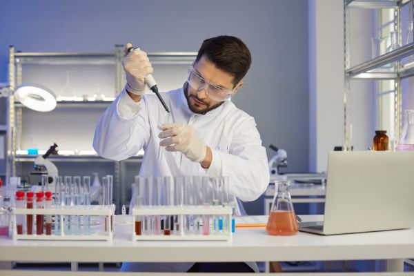 A technologist is examining bloodwork samples. Find out more about medical laboratory technologist salaries, career opportunities, and more in Canada.