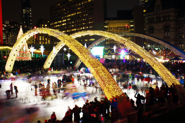 People skating on the outdoor rink at Nathan Phillips Square is one way to celebrate Christmas in Canada.