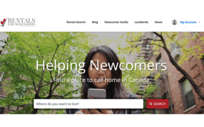 A young woman is looking at her mobile phone to learn how to find accommodation in Canada with Rentals for Newcomers