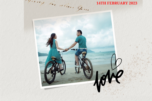 A photo of a couple on bikes along the shoreline of a romantic beach. A photo book can be a great Valentine's Day gift