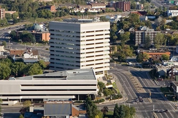 The City of Greater Sudbury is located in northeastern Ontario with a population of 166,000. Aerial view of Sudbury City Hall and surrounding businesses and homes. 