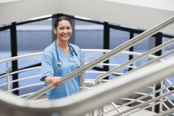 A smiling female nurse who meets the nursing job and employment requirements in Canada. 