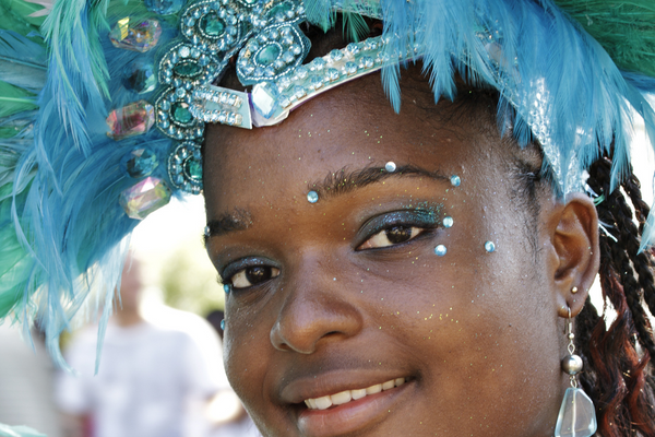 Young women dressed in a blue Caribbean costume. The Caribana Parade is one of the most anticipated summer festivals in 2023!