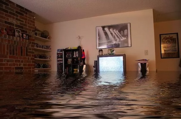Insurance in Canada protects your property. Interior of a home with several feet of water.